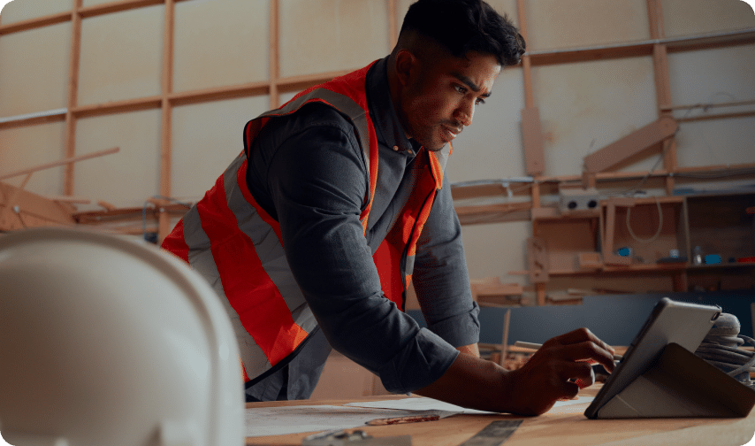 Construction worker using a tablet