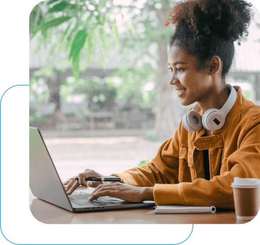 Woman smiling working on a laptop