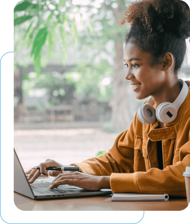 Woman smiling working on a laptop