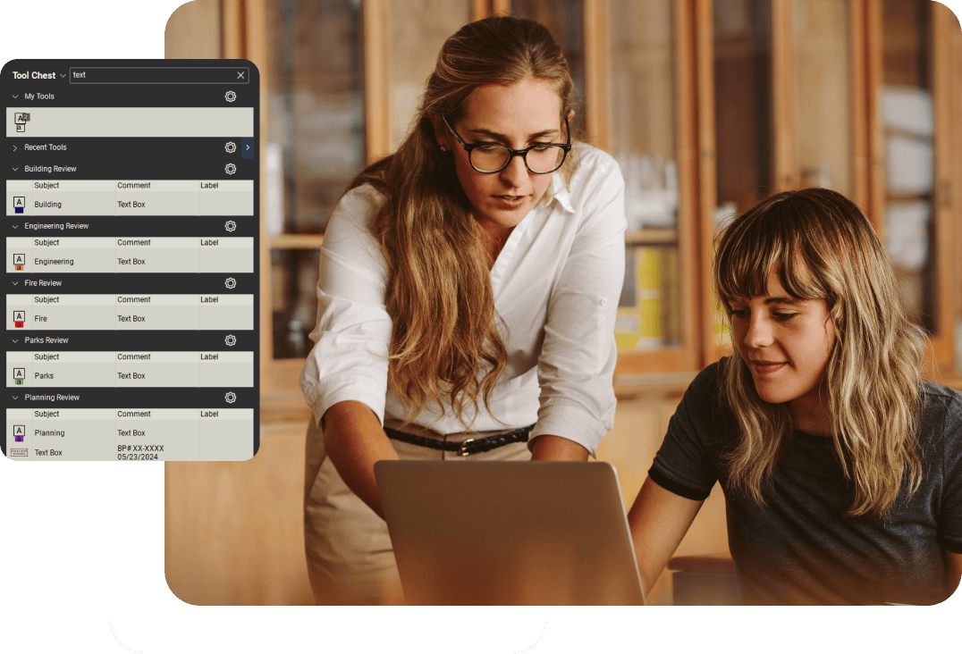 Two people working on a laptop